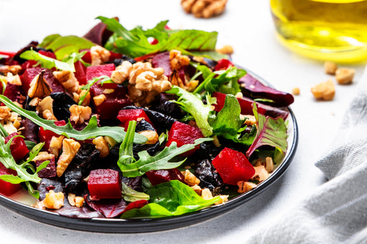 Roasted beet salad with ShopGalil walnuts, greens, and feta, tossed in balsamic dressing for a fresh Passover side