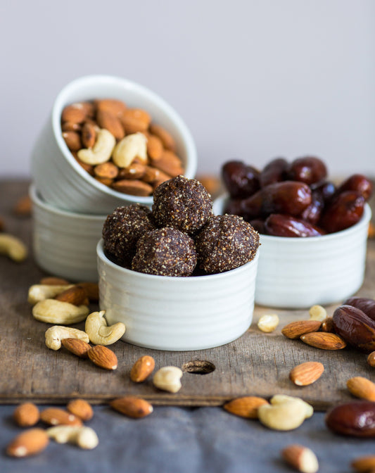 Date Energy Bites made with ShopGalil dates, mixed nuts, coconut flakes, and honey, a sweet and healthy snack for Passover.